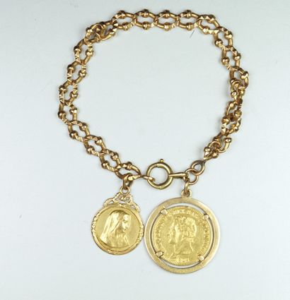 null Bracelet en or jaune 18K (750/oo)maille fantaisie agrémenté d’une médaille religieuse...