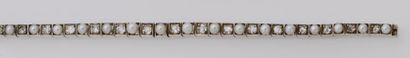 null Bracelet ligne en argent (900/oo) et or jaune 18K (750/oo) composé de maillons...