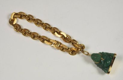 null Gourmette en or ( 18 carats 750 millièmes ) agrémentée d' un pendentif en jade,...