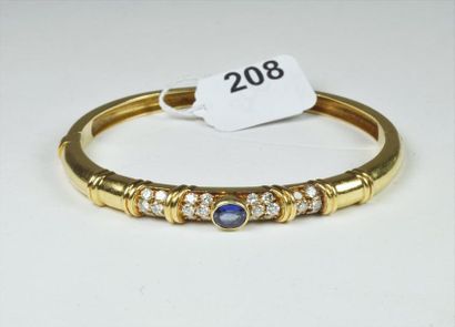 null Bracelet "Jonc" ouvrant en or jaune 18K (750/oo) à motifs de godrons serti de...