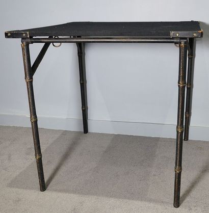 JACQUES ADNET (1900-1984). Table à jeux pliante , à plateau carré en bois recouvert...