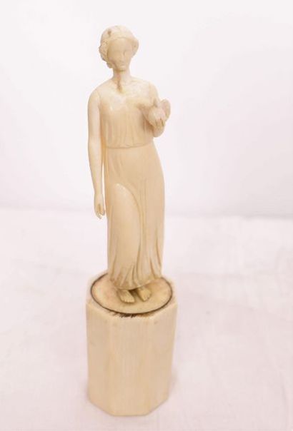 null ART DECO IVORY SUBJECT "YOUNG LADY WITH DOVE".

In carved ivory, resting on...