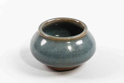 null Small globular Junyao pot in porcelain with a monochrome turquoise glaze spotted...