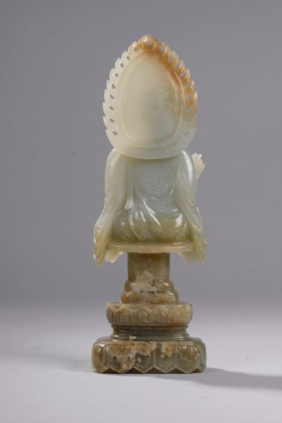 null Bust of Buddha Sakyamuni with a quadrangular face and rounded cheekbones, half-closed...