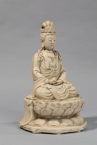 null The Boddhisattva Kwan Yin sitting in meditation on a lotiform pedestal dressed...