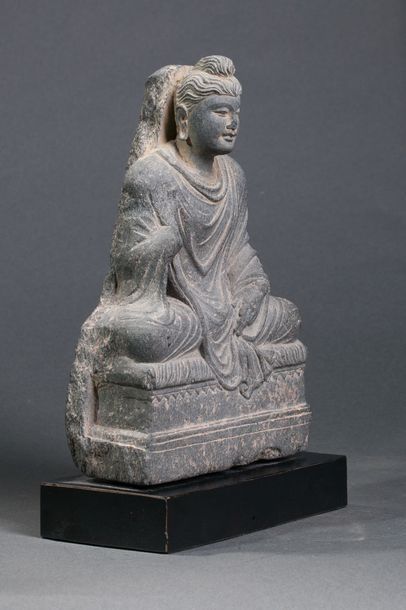 null Buddha Maitreya, sitting in meditation on a quadrangular base dressed in a monastic...