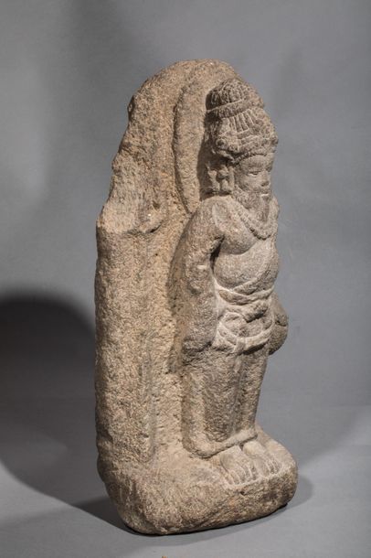null Stele illustrating bearded Shiva, wearing an ascetic's bun held by a tie, standing...