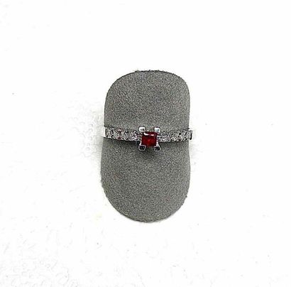 null White gold ring set with a square ruby of very nice color, ring enhanced by...