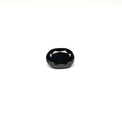 null A large oval sapphire on paper weighing 6.68 c. 2 baroque natural pearls are...