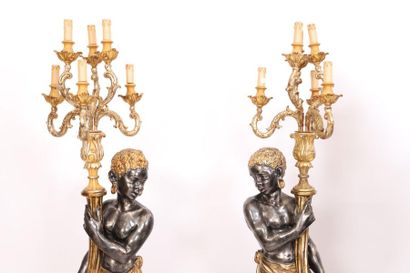 null PAIR OF ITALIAN "YOUNG MOORISH" TORCH HOLDERS. 

Made of lacquered and gilded...