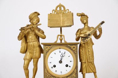 null GILDED BRONZE CLOCK "COUPLE OF MUSICIANS" RESTORATION

In gilt bronze, with...