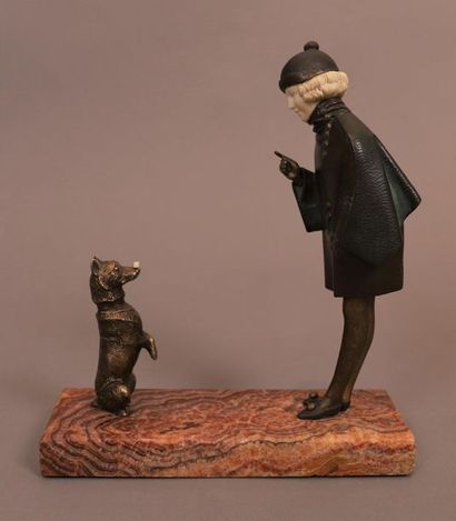 null CHRYSELEPHANTINE SCULPTURE "SMALL GIRL PLAYING WITH HER DOG" by André Vincent...