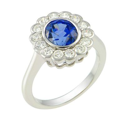 null A white gold ring in a closed case of an oval Natural CEYLAN sapphire of an...