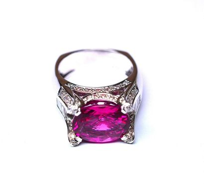 null White gold ring supporting a rare oval rubelite weighing 5.50 c. approx. of...