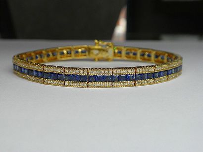 null Yellow gold line bracelet set with beautifully coloured calibrated sapphires...