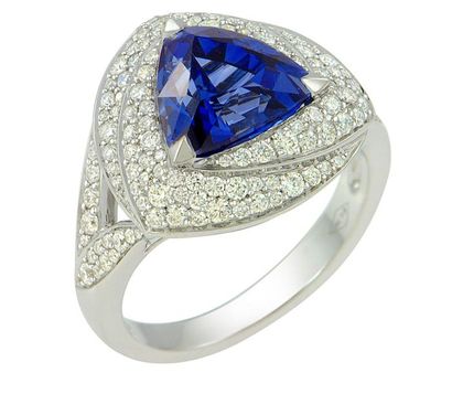 null White gold ring centered with a CEYLAN triangular sapphire of a sparkling royal...