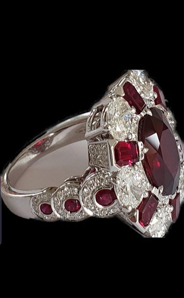 null Exceptional high jewelry ring centered of an oval NATURAL NON HEATED ruby for...