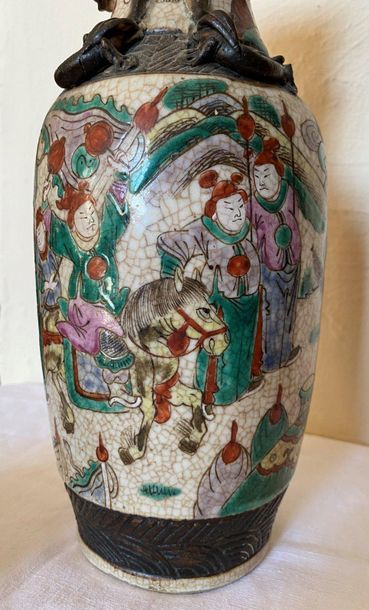 null CHINA

Earthenware vase of NANKIN of baluster shape - A decoration of war games...