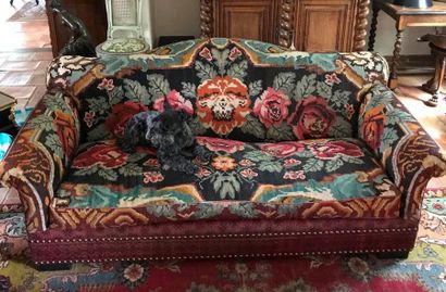 null A three-seater sofa covered with Kilim upholstery 

20th Century 

H: 84 x W:...