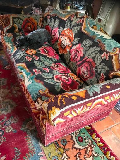 null A three-seater sofa covered with Kilim upholstery 

20th Century 

H: 84 x W:...