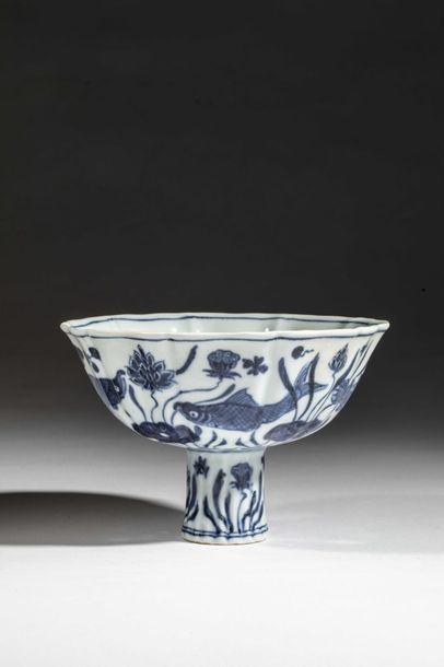 null Stem cup on high foot in white porcelain in cobalt blue under a lake scene animated...