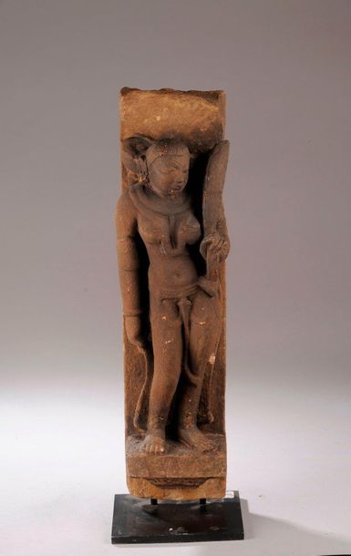 null Saptamatrika, one of the seven mothers of India, standing slightly hipped in...