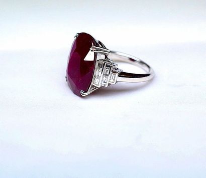 null White gold ring centered of a very important Natural NON HEATED oval ruby probably...