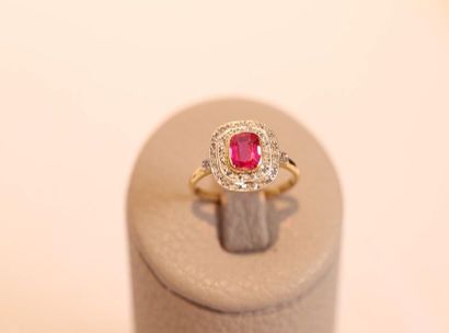 null 18 karat yellow gold ring set with a red stone in an entouage of roses 

(misses...