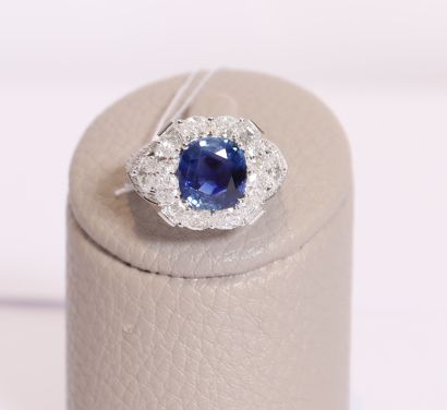  White gold ring centered with a NATURAL UNHEATED cushion sapphire, probably Ceylon,...