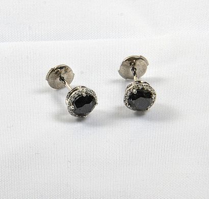 Pair of white gold earrings centered with...