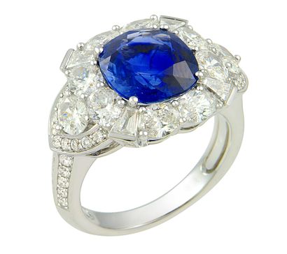 null White gold ring centered with a NATURAL UNHEATED cushion sapphire, probably...