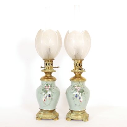 null PAIR OF OIL LAMPS WITH BRANCHES ON A CELADON BACKGROUND 

Brass and glassware,...