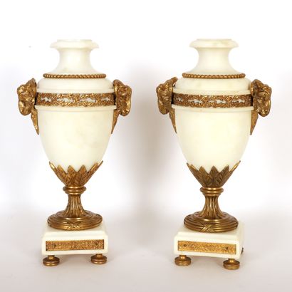  PAIR OF LOUIS XVI STYLE MARBLE AND GILT BRONZE CASSOLLETTES 
Ram's head handles,...