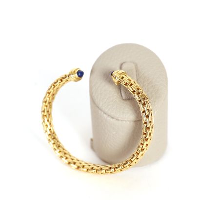 SOFT BRACELET IN 18K YELLOW GOLD Ornamented with lapis lazulis at its ends of about...