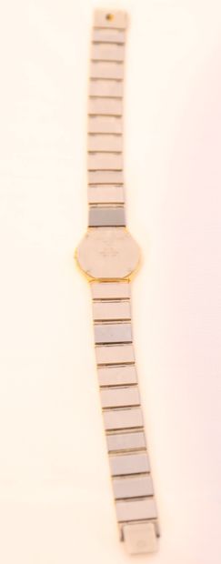  LADY'S WATCH IN YELLOW GOLD AND STEEL "AVANT-GARDE" by BAUME MERCIER 
Articulated...