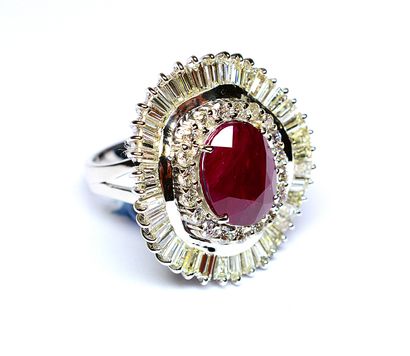 null Important white gold skirt ring holding an oval NATURAL BIRMAN ruby weighing...