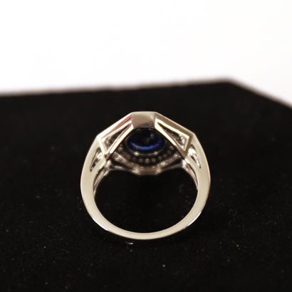 null Octagonal white gold ring set with a round unheated NATURAL Ceylon sapphire...