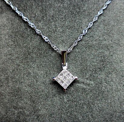 null A pendant of "diamond" shape set by 9 diamonds (G VS) in invisible setting for...