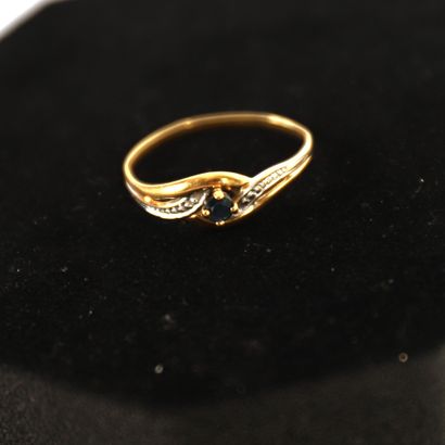 YELLOW GOLD RING WITH A SMALL ROUND SAPPHIRE...