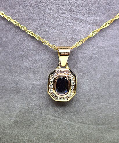Yellow gold pendant centered in close with...