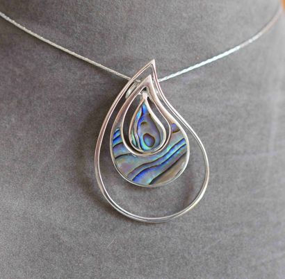 Pendant on its chain out of solid silver...