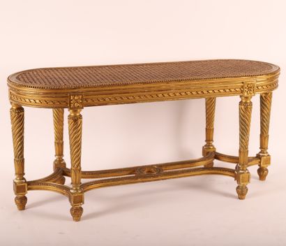 null Gilded wood bench LOUIS XVI, 19th century

Caned seat 

Twisted legs linked...