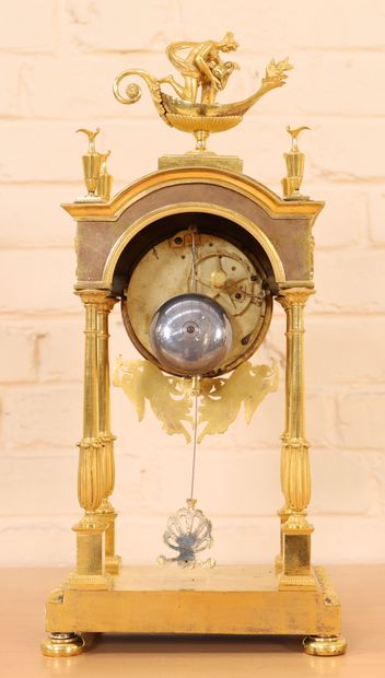 null GILT BRONZE PORTICO CLOCK RESTORATION 

In gilt bronze and chased, with four...