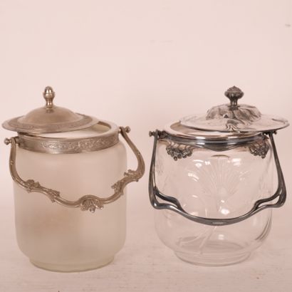 null TWO GLASS AND METAL COOKIE JARS 

One of which is Art Nouveau style with engraved...