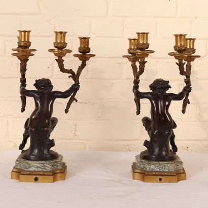 null PAIR OF CANDELABRA WITH SATYRS IN BRONZE AFTER CLODION
With four arms of lights...