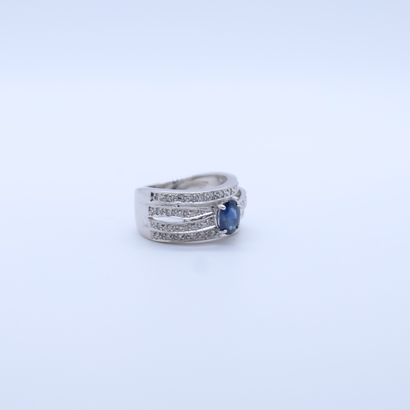 null WHITE GOLD RING SET WITH A CUSHION CUT SAPPHIRE OF ABOUT 2.04 CARAT AND 4 ROWS...