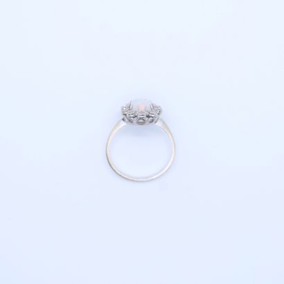 null WHITE GOLD POMPADOUR RING SET WITH AN IRIDESCENT OPAL IN A SETTING OF 10 BRILLIANT-CUT...