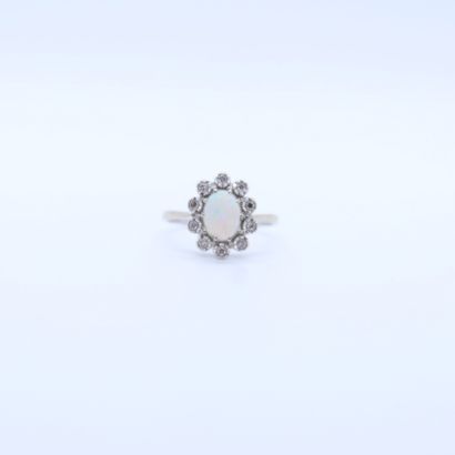 null WHITE GOLD POMPADOUR RING SET WITH AN IRIDESCENT OPAL IN A SETTING OF 10 BRILLIANT-CUT...