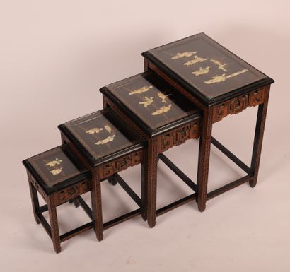 null SUITE OF 4 JAPANESE-STYLE NESTING TABLES
Black patina wood, resin relief decoration,...