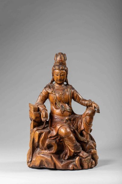 null Le Boddhisattva Kwan Yin Avalokitésvara assis en délassement sur un rocher vêtu...